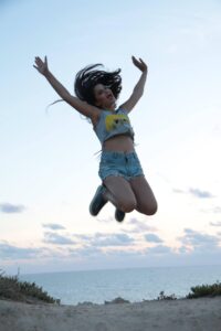 Women jumping on beach